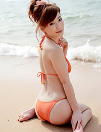 Smoking-hot Asian teen cutie Kaho Kasumi enjoys summer posing temptingly in her orange bikini.