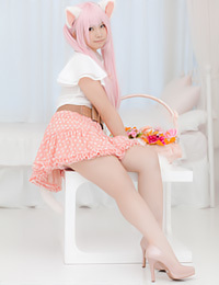 Enako slowly strips out of her clothes for the camera.